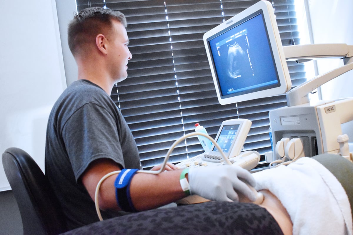 General Sonography student practicing on classmate