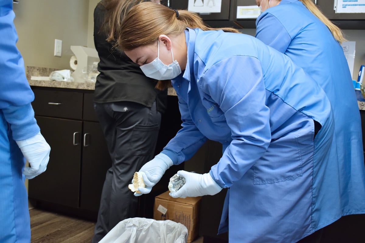Dental Assisting student working with molds