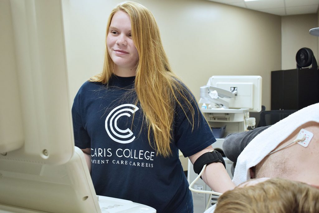 Cardiac Sonography student performing exam on fellow student