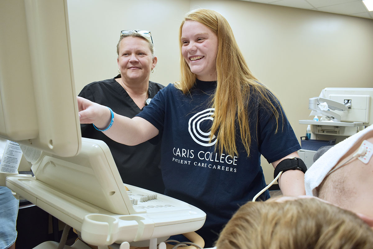 Cardiac Sonograph student and instructor reviewing exam results