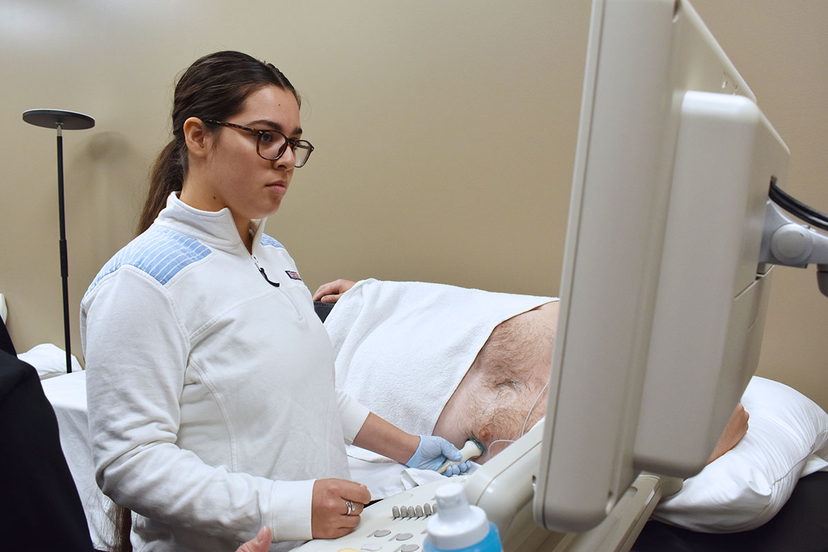 Cardiac Sonography student practicing exam on patient