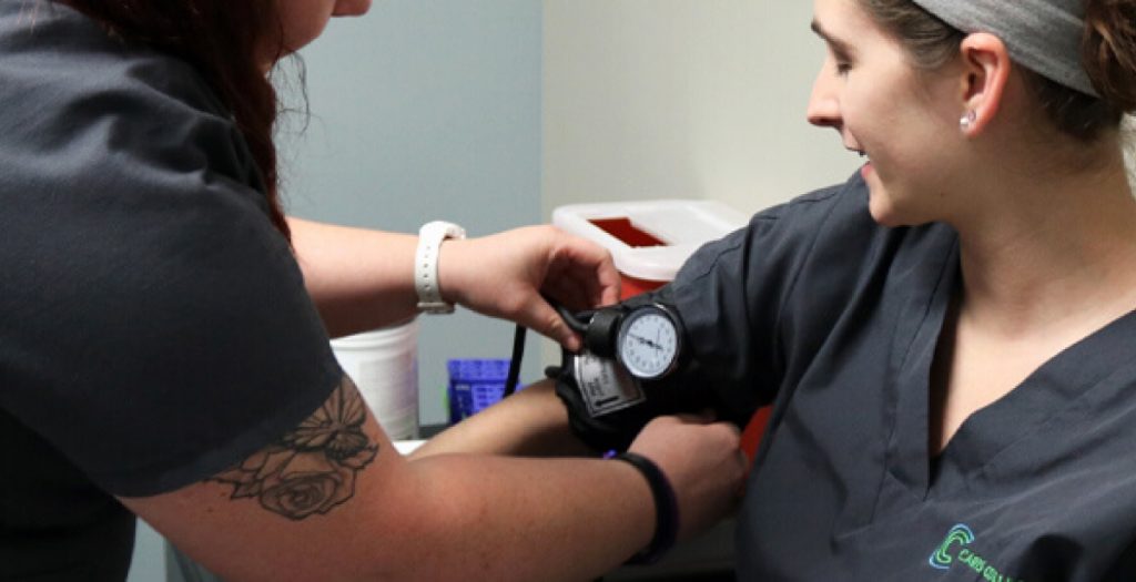 someone checking blood pressure